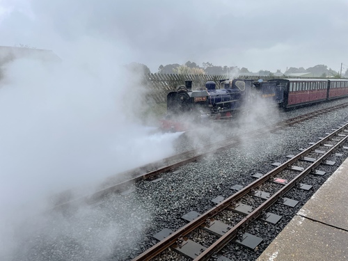 The same dark blue engine, almost invisible behind the enormous cloud of smoke it’s producing.